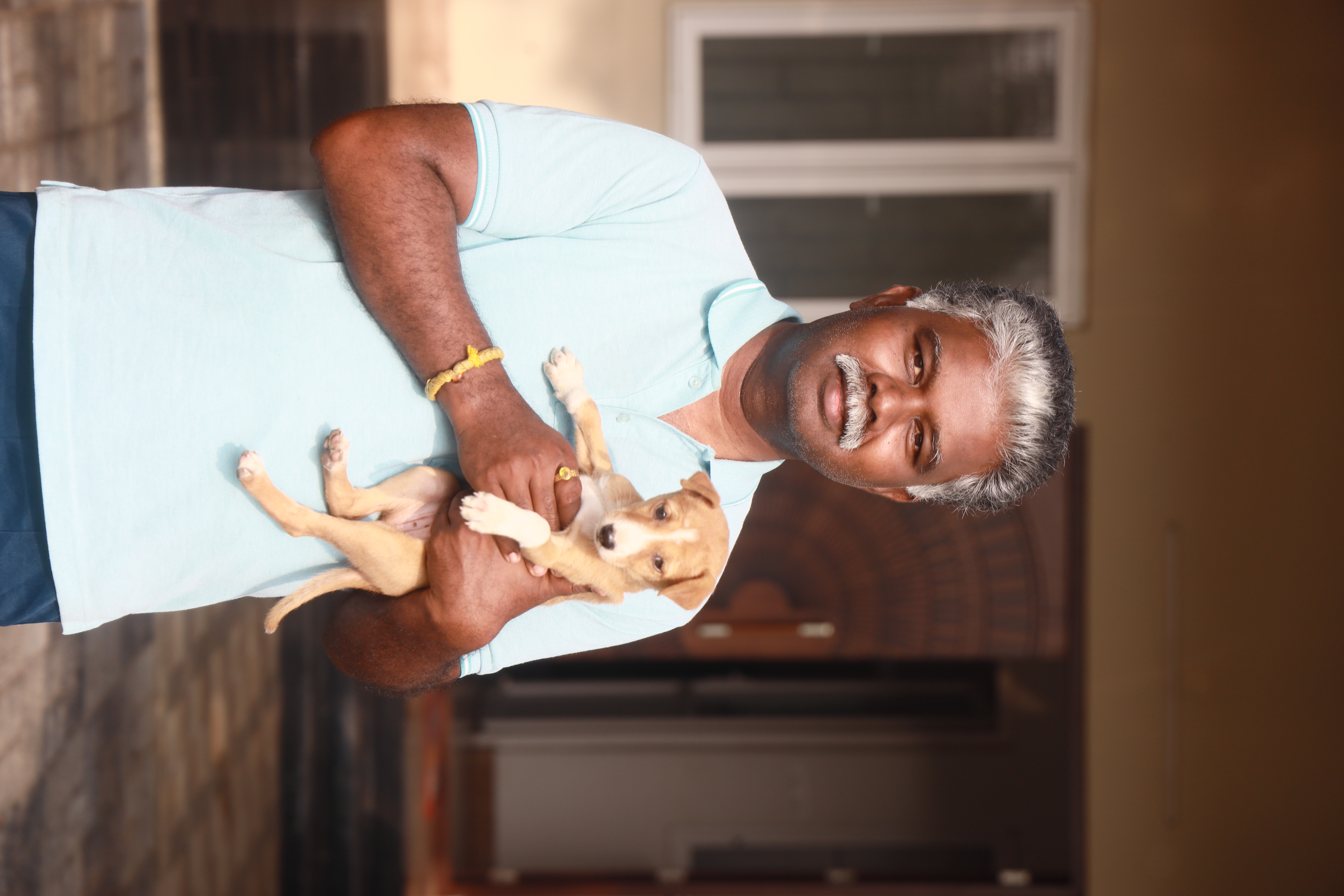 Volunteer supporting animals with water and care